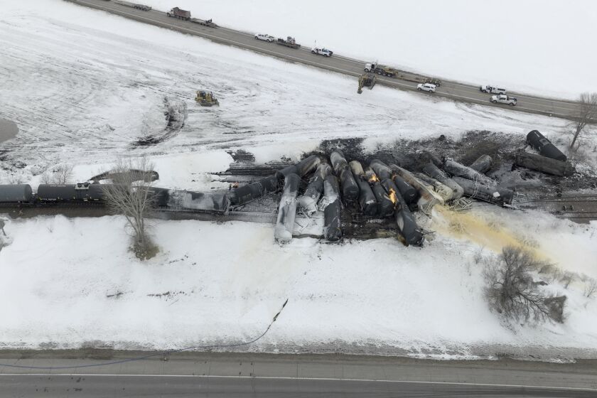 A BNSF train carrying ethanol and corn syrup derailed and caught fire in Raymond, Minn., Thursday, March 30, 2023. BNSF officials said 22 cars derailed, including about 10 carrying ethanol, and the track remains blocked, but that no injuries were reported due to the accident. The cause of the derailment hasn't been determined. (Mark Vancleave /Star Tribune via AP)