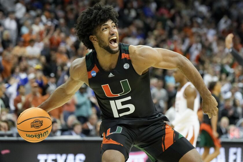 Miami forward Norchad Omier celebrates after their win against Texas in an Elite 8 college basketball game in the Midwest Regional of the NCAA Tournament Sunday, March 26, 2023, in Kansas City, Mo. (AP Photo/Jeff Roberson)