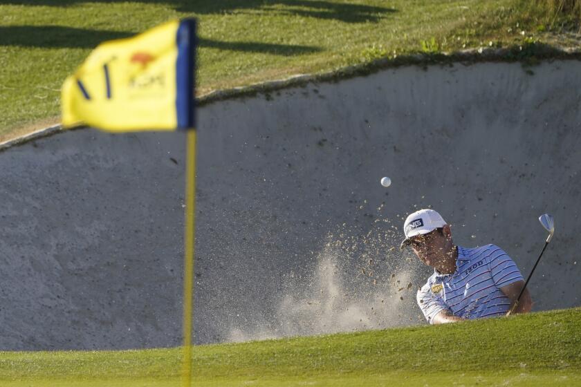 Louis Oosthuizen, of South Africa, hits out of the bunker on the 17th hole during the second round of the PGA Championship.