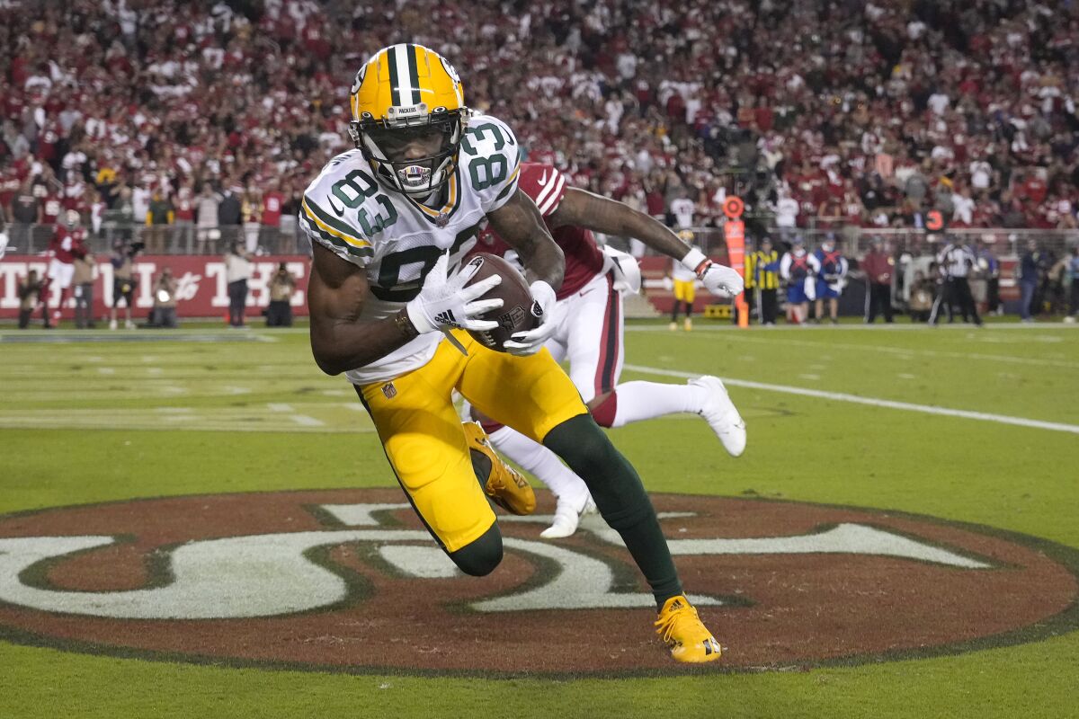 Green Bay Packers wide receiver Marquez Valdes-Scantling (83) catches a touchdown pass against the San Francisco 49ers during the second half of an NFL football game in Santa Clara, Calif., Sunday, Sept. 26, 2021. (AP Photo/Tony Avelar)