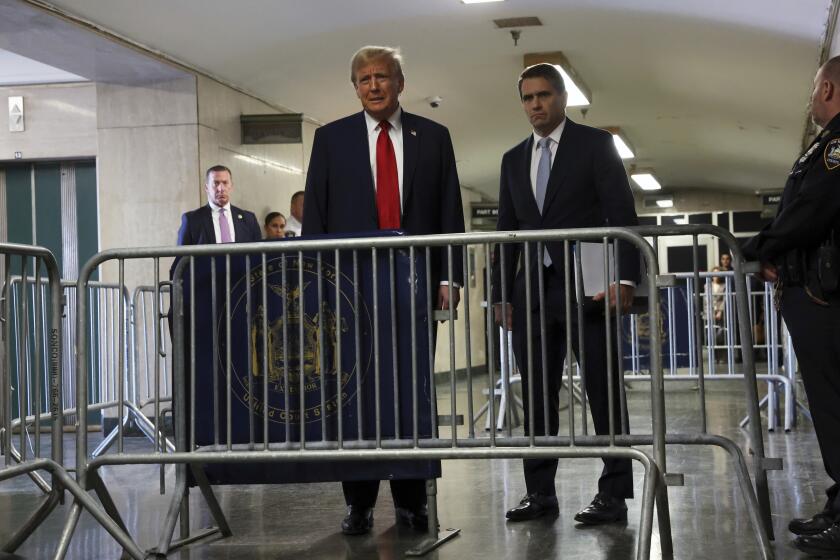 Former President Donald Trump speaks to the media at Manhattan criminal court during the continuation of his trial on Thursday, April 25, 2024, in New York. His attorney, Todd Blanche, is on right. (Spencer Platt/Pool Photo via AP)