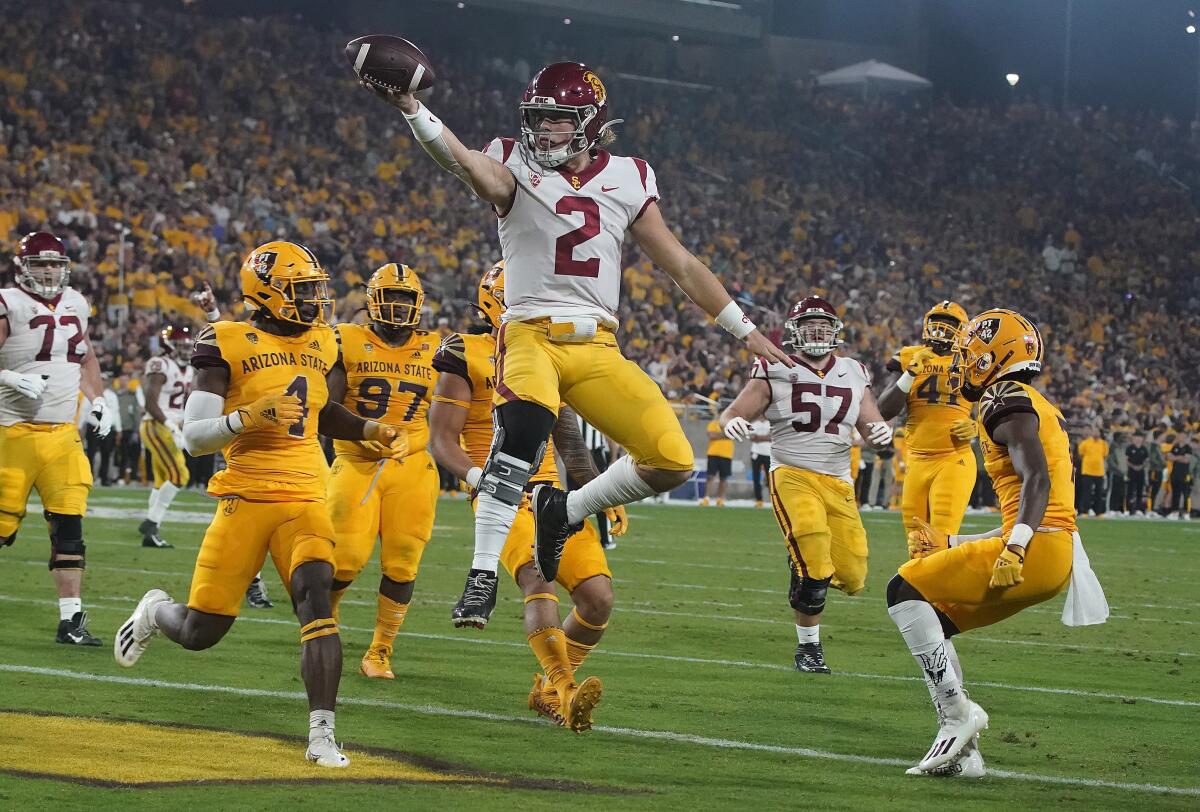 USC quarterback Jaxson Dart celebrates as he scores a touchdown against Arizona State on Nov. 6.