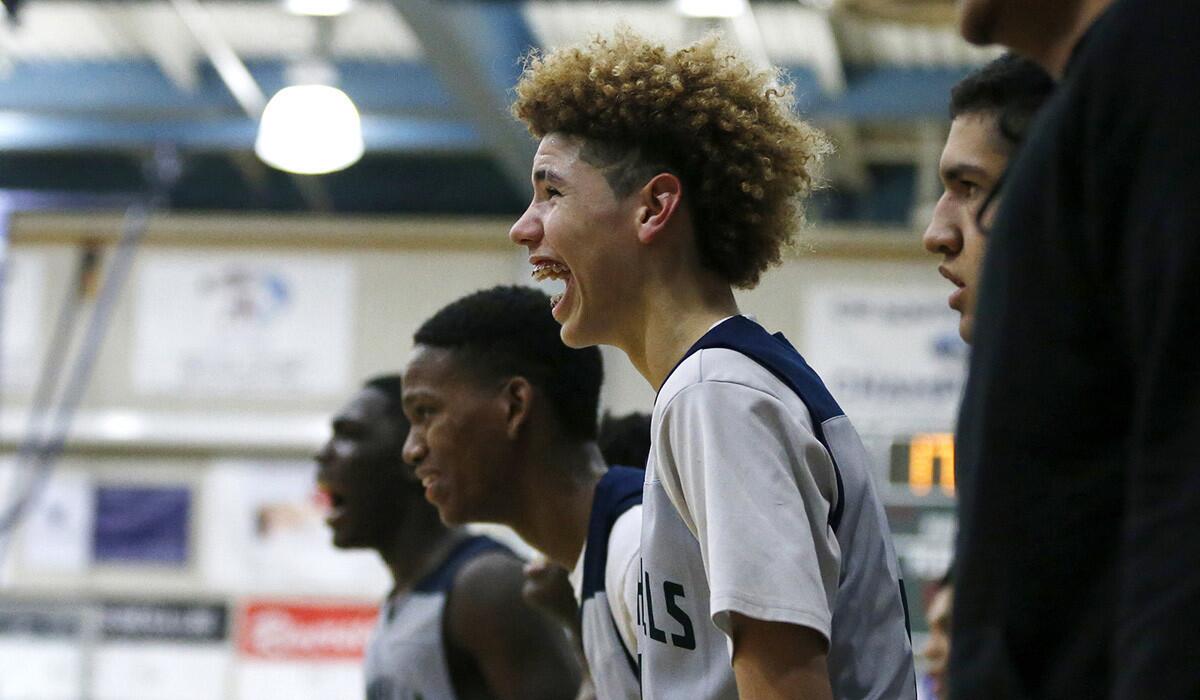 Chino Hills LaMelo Ball cheers for the Huskies during a game against Damien on Jan. 10.
