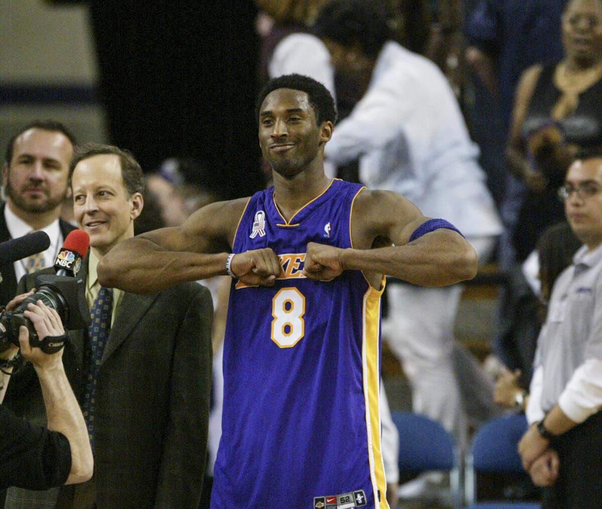 Kobe Bryant interacts with fans before a TV interview with Jim Gray.