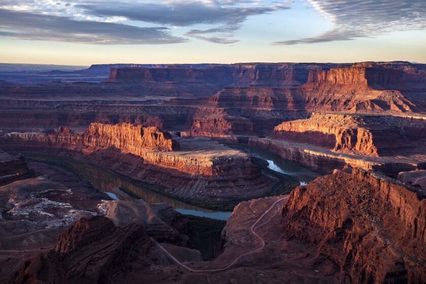 The Colorado River winds around the northern reaches of the Bear Ears National Monument, with Canyonlands National Park in the background, viewed from Dead Horse Point State Park near Moab, Utah.