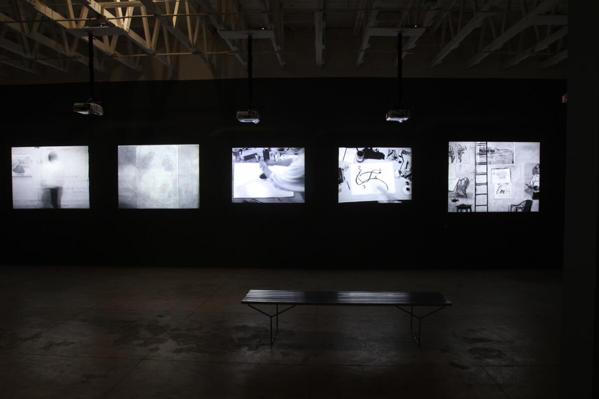 An installation view of "Journey to the Moon," a series of video works by the South African artist William Kentridge at the Underground Museum.
