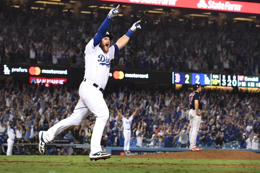Dodgers Max Muncy hits the game-winning home run against the Red Sox in the bottom of the 18th inning.