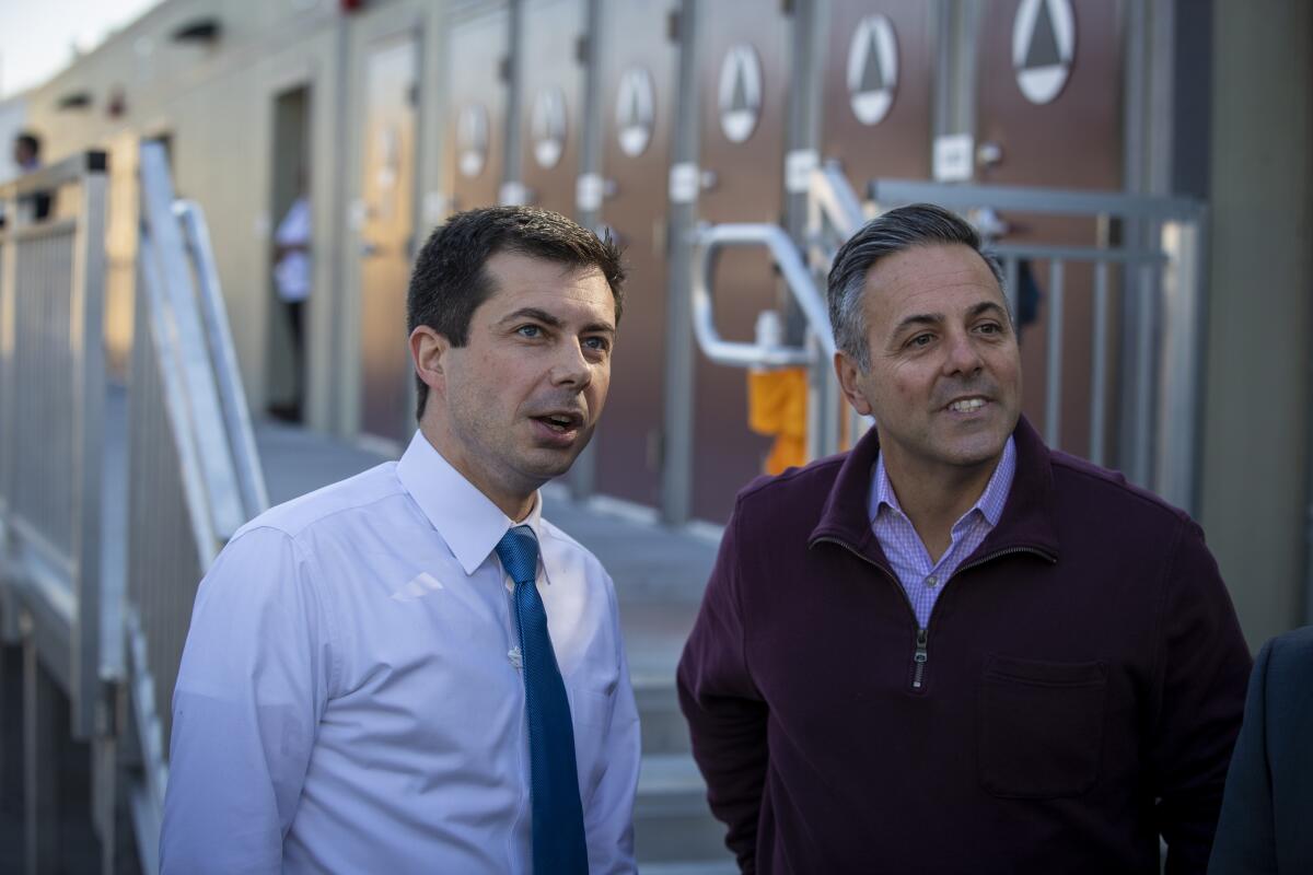 Councilman Joe Buscaino, right, visits Watts with then-Democratic presidential candidate Pete Buttigieg in 2020.