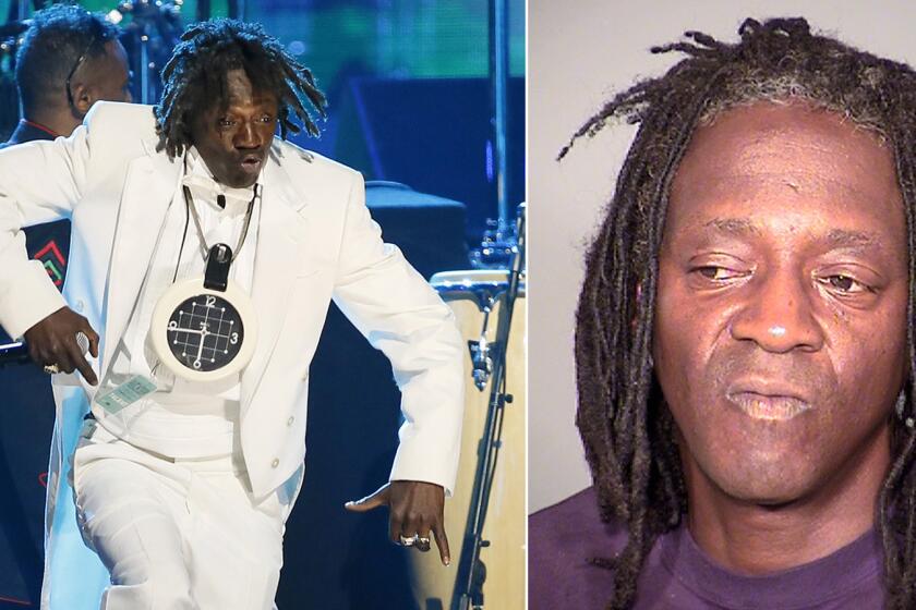 Flavor Flav performing during Public Enemy's induction into the Rock and Roll Hall of Fame in April 2013, left, and in a booking photo taken following his May 21 arrest in Las Vegas.