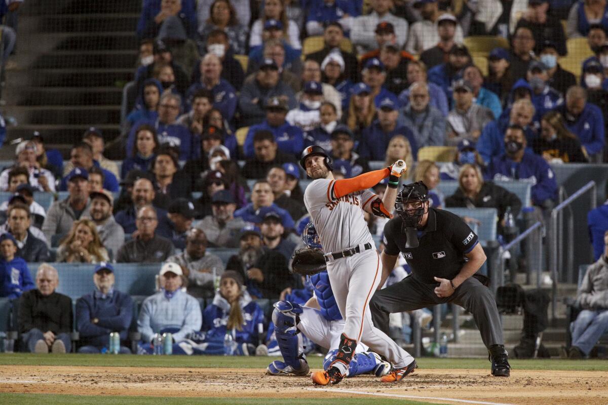 San Francisco's Evan Longoria follows through on a solo home run in the fifth inning.