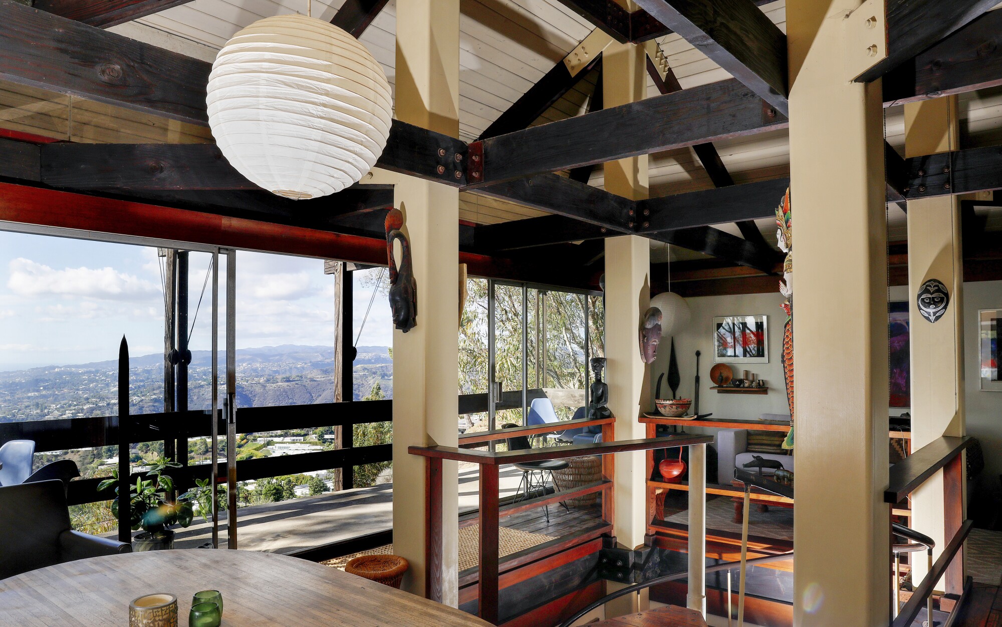 A view of Bernard Judge's Tree House shows the living room at an angle, with views of L.A. hillsides in the distance