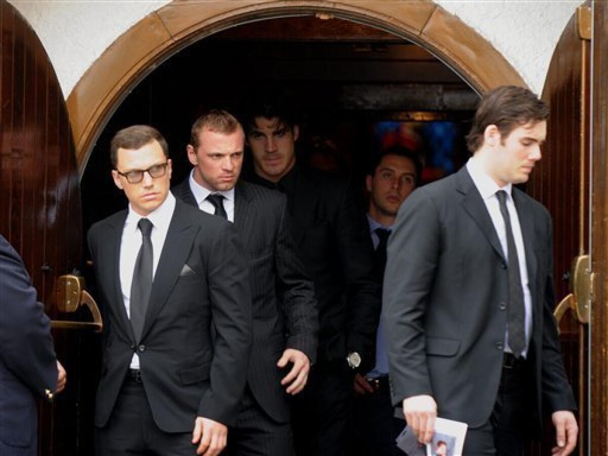 Brendan Shanahan, center-left, and other mourners leave the RCMP Depot  after the funeral service of Derek Boogaard in Regina, Saskatchewan, Canada  on Saturday, May 21, 2011. Boogaard, a professional hockey player who