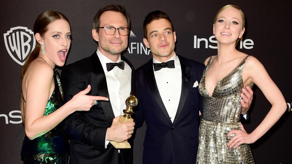 "Mr. Robot" actors Carly Chaikin, left, Christian Slater, Rami Malek and Portia Doubleday celebrate their show's television drama victory, and Slater's supporting actor win, at the InStyle / Warner Bros. Golden Globes after party.