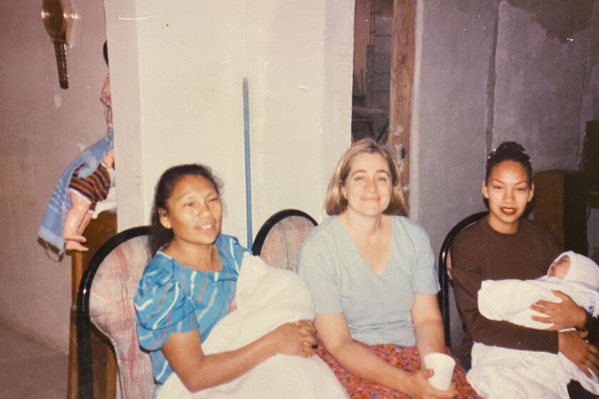 Angela, Sandra and Teresa with two babies at Angela's home in Tijuana.