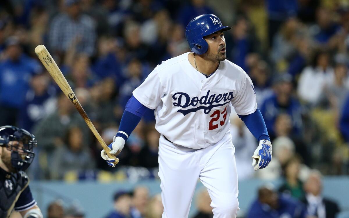 Adrian Gonzalez watches his third home run of the game Wednesday during the fifth inning against the San Diego Padres at Dodger Stadium.