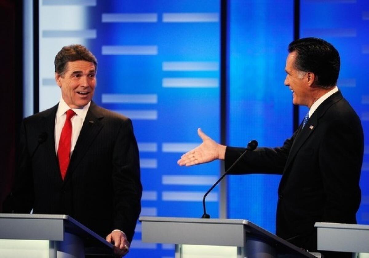 Mitt Romney offers Rick Perry a $10,000 wager during Saturday's Iowa Republican debate in Des Moines.
