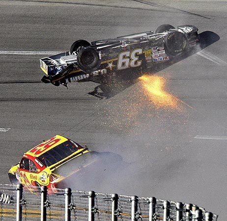 Ryan Newman slides upside down on the track after crashing into Kevin Harvick during the AMP Energy 500 race at Talladega. Jamie McMurray won the crash-filled race.