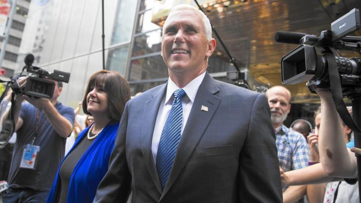 Indiana Gov. Mike Pence and his wife, Karen, leave a meeting with Republican presidential candidate Donald Trump on Friday at Trump Tower in New York.