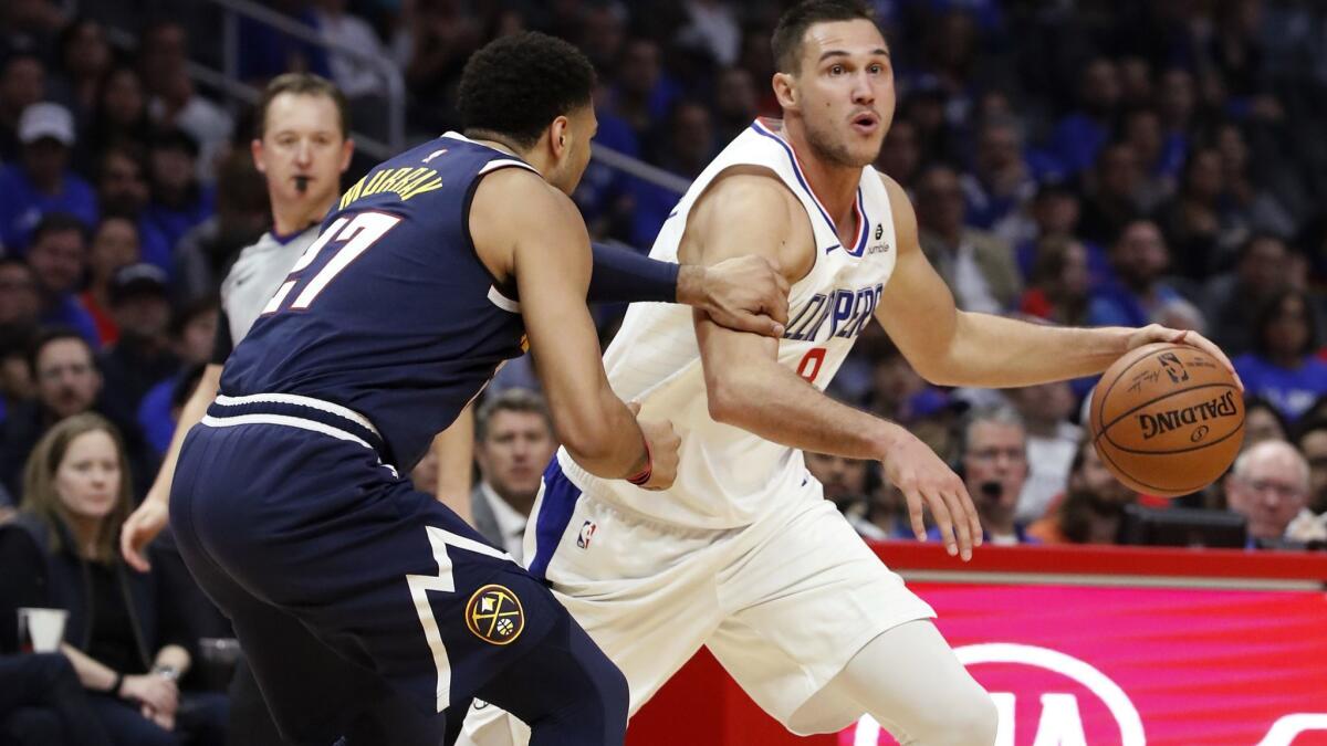 Clippers forward Danilo Galinari drives to the basket against Nuggets guard Jamal Murray in the second quarter Wednesday night at Staples Center.