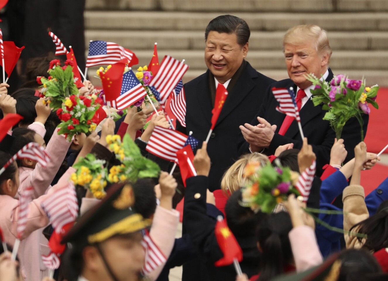 President Trump and Chinese President Xi Jinping at a welcoming ceremony at the Great Hall of the People in Beijing.