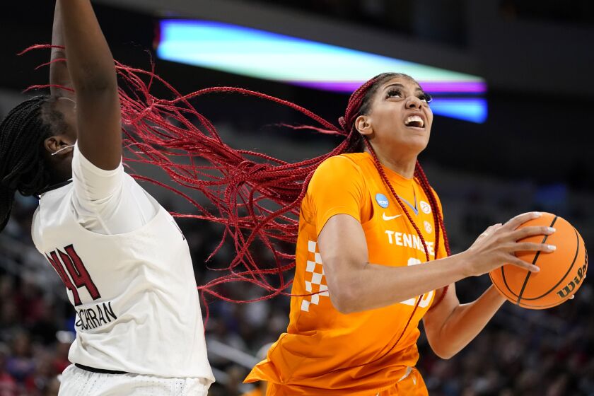 FILE - Tennessee's Tamari Key, right, heads to the basket as Louisville's Olivia Cochran defends during the second half of a college basketball game in the Sweet 16 round of the NCAA women's tournament on March 26, 2022, in Wichita, Kan. Key will miss the rest of this season because of blood clots in her lungs, coach Kellie Harper said Thursday, Dec. 8. (AP Photo/Jeff Roberson, File)