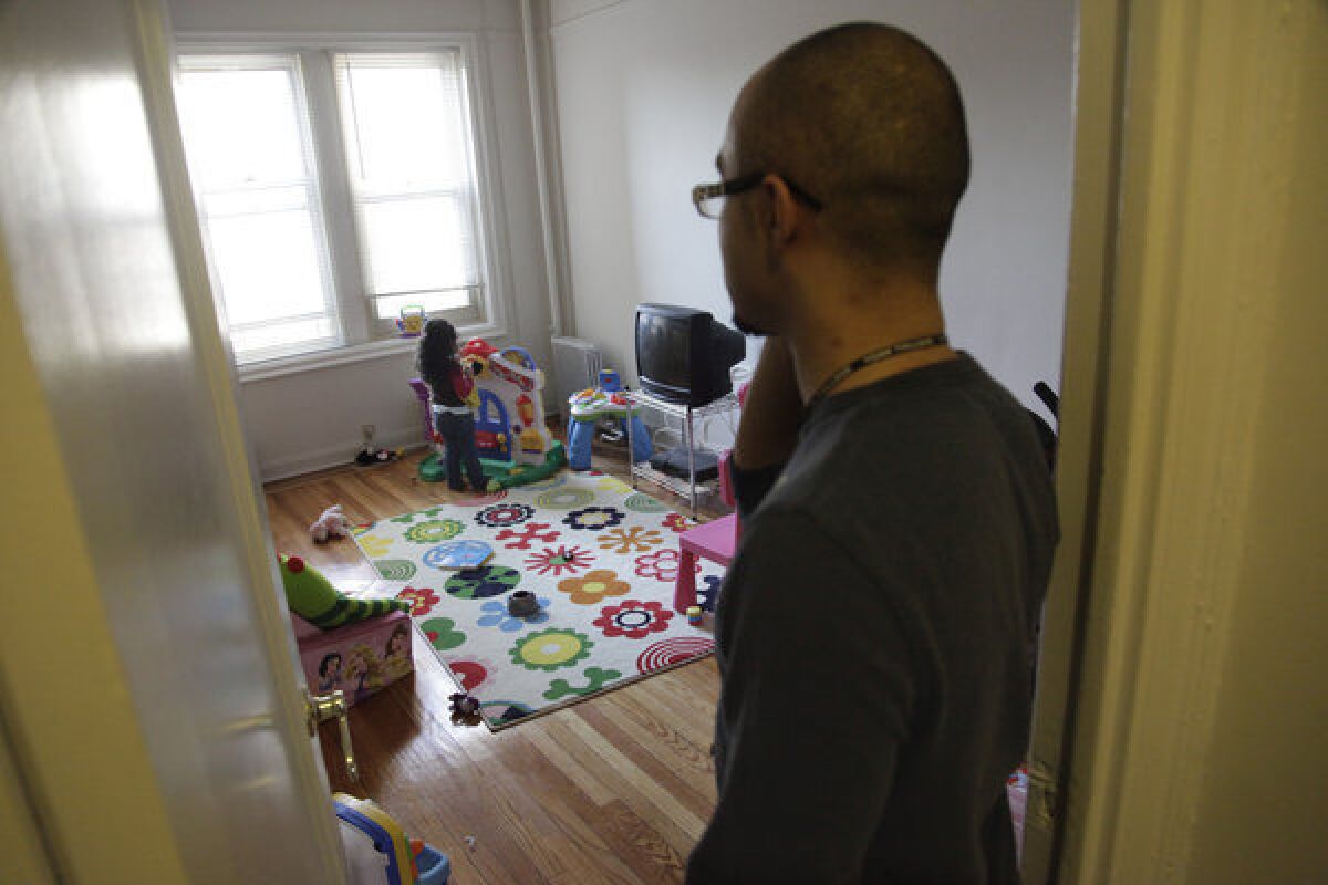 Christopher Astacio stands in the doorway watching as his daughter Cristina, 2, recently diagnosed with a mild form of autism, plays in her bedroom. A new study found the autism rate is on the rise again.