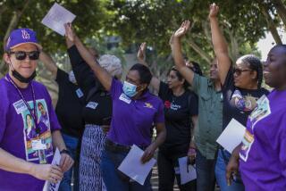 Los Angeles, CA - June 29: Healthcare workers celebrate as Los Angeles City Council gives a final approval to an ordinance raising the minimum wage for people working at some healthcare facilities in the city to $25 per hour, at assembly session held at City Hall on Wednesday, June 29, 2022 in Los Angeles, CA. (Irfan Khan / Los Angeles Times)