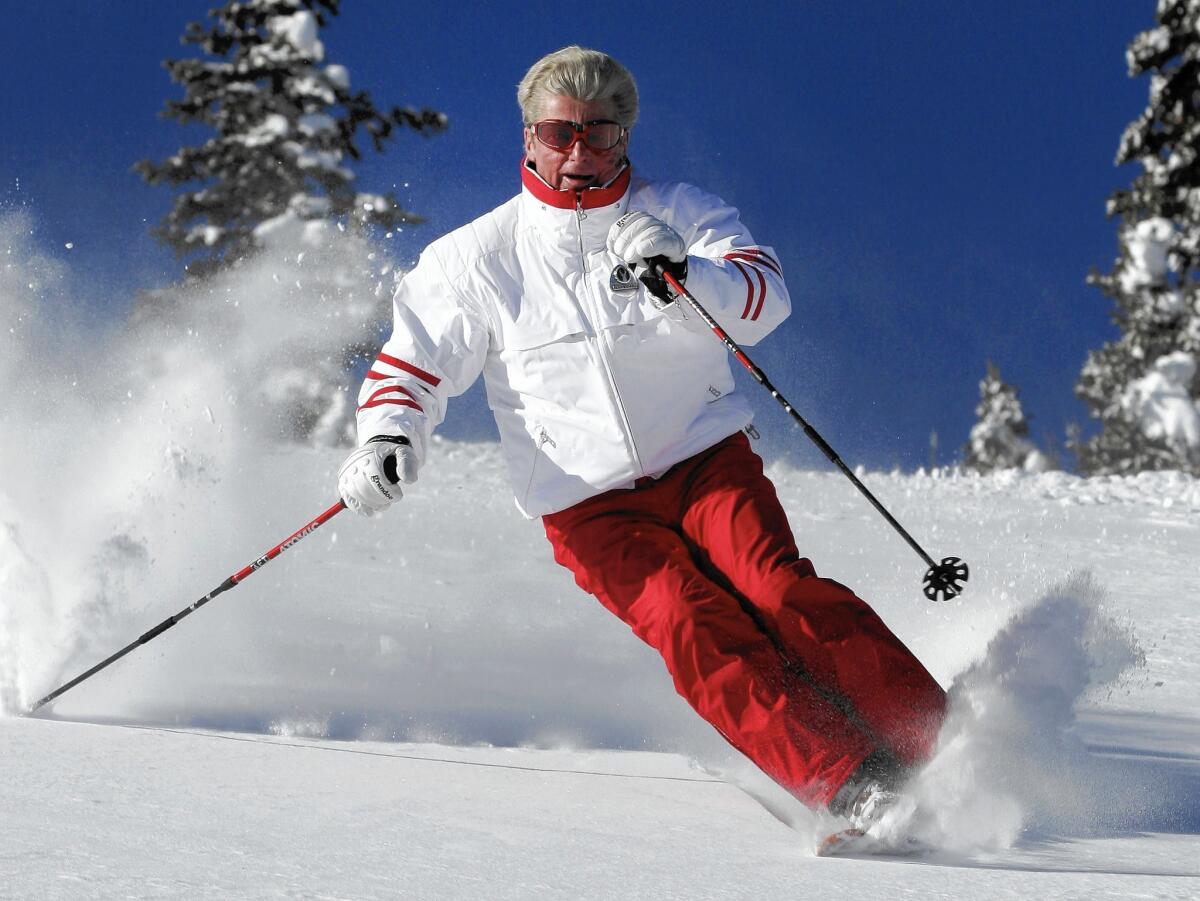 Stein Eriksen skiing at Deer Valley Resort in Park City, Utah, in 2005. He captured gold in giant slalom and silver in slalom in the 1952 Winter Games in Oslo. Later, he held positions at various ski resorts in the United States.