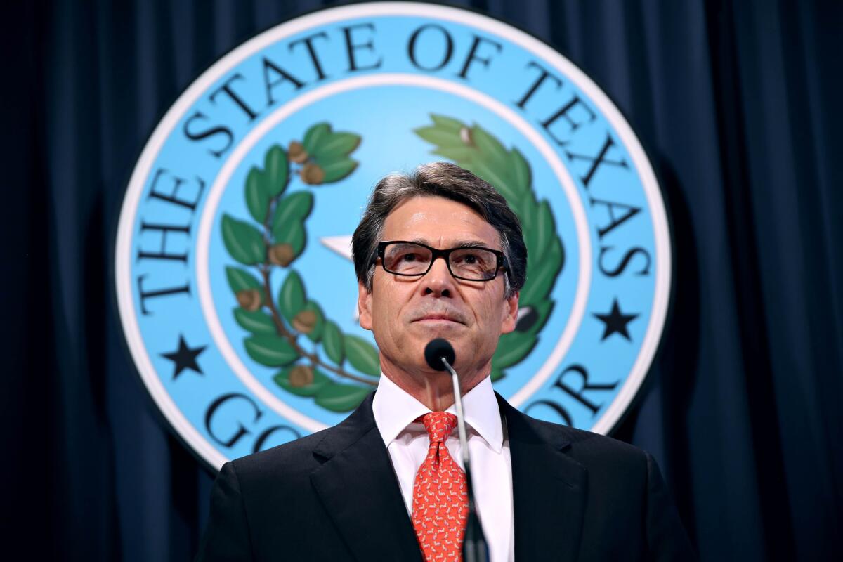 Gov. Rick Perry makes a statement at the capitol building in Austin, Texas concerning the indictment on charges of coercion of a public servant and abuse of his official capacity. Perry is the first Texas governor since 1917 to be indicted.