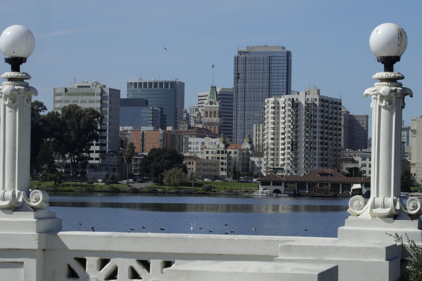 The Oakland skyline is seen from Lake Merritt on Wednesday, March 4, 2020, in Oakland, Calif.