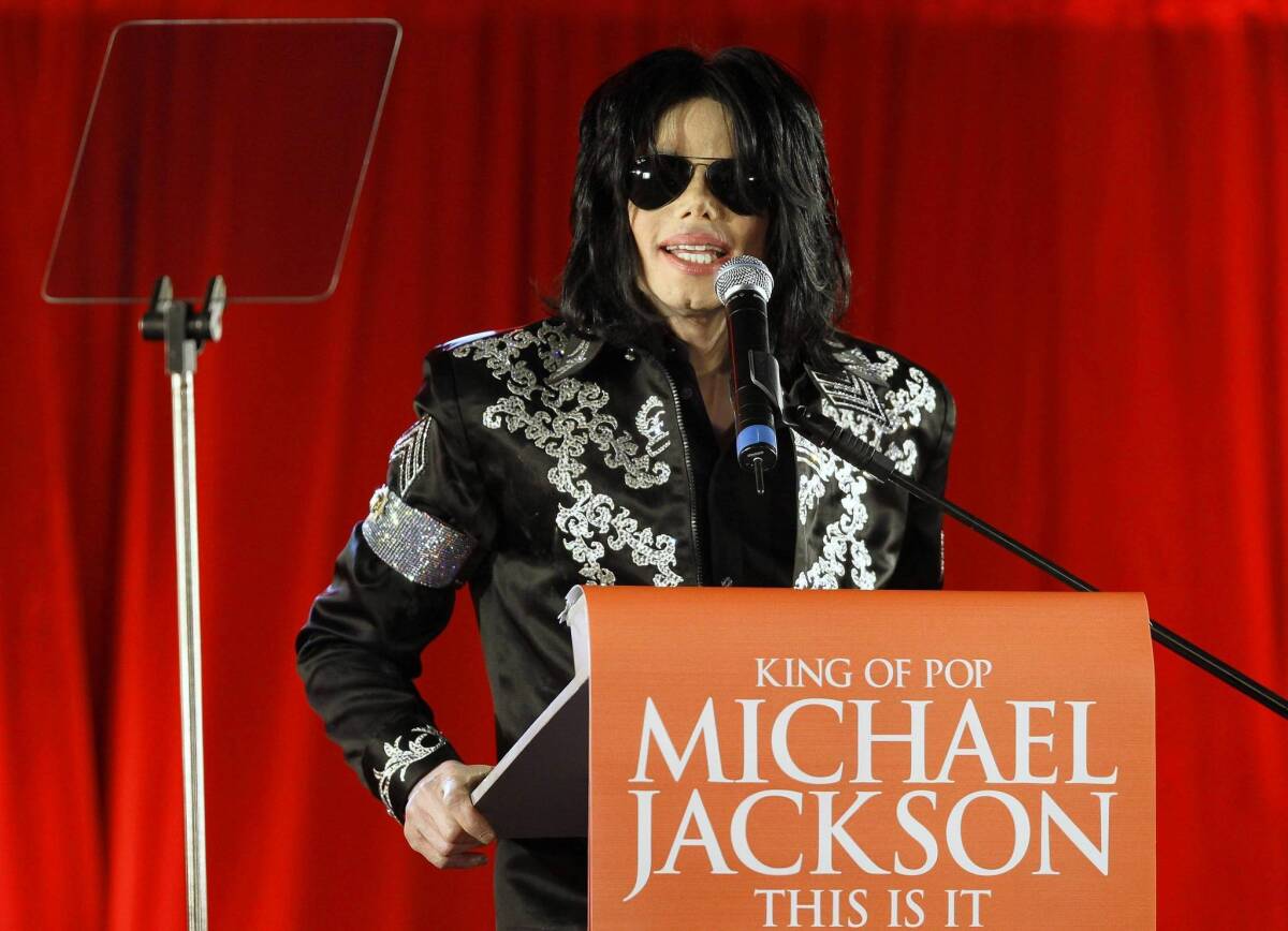 Michael Jackson, shown in March 2009, announces his 50-show "This Is It" comeback concerts set for July of that year at London's O2 Arena. His mother and children have filed a wrongful-death suit against concert promoter AEG Live.