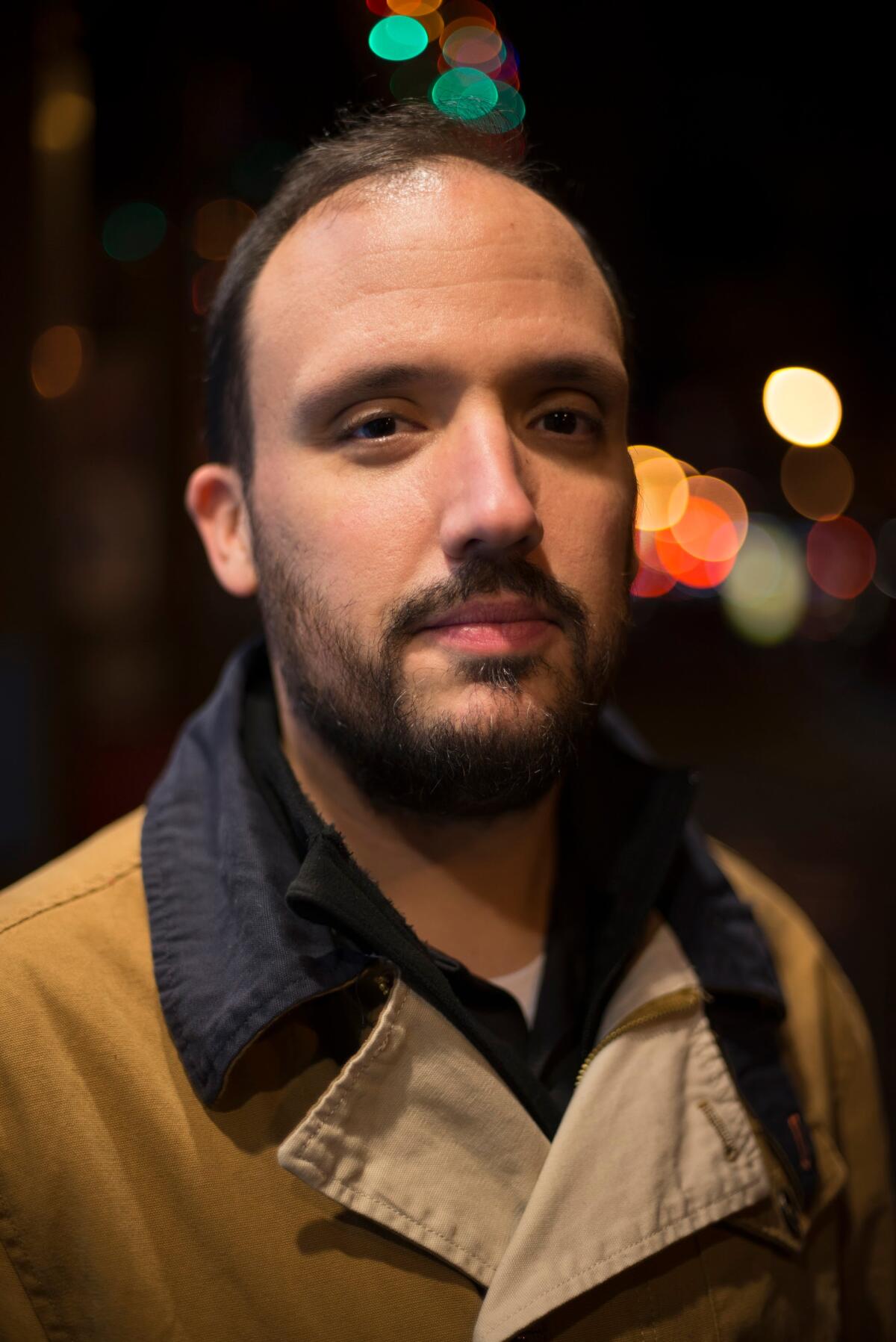 A portrait photo of author Alex Segura.