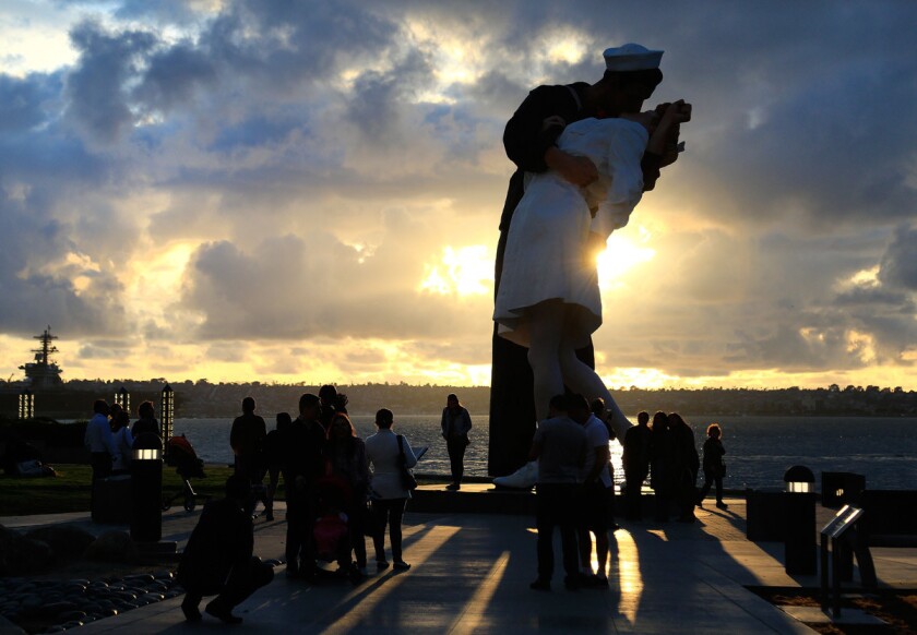 People come to San Diego's Tuna Harbor Park to watch the sunset at the "Unconditional Surrender" statue. (Misael Virgen)