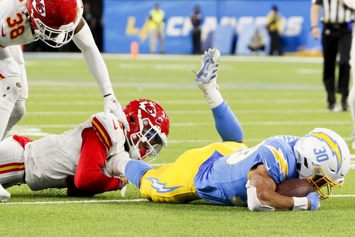 Chiefs safety Bryan Cook (6) tackles Chargers running back Austin Ekeler (30) last November.