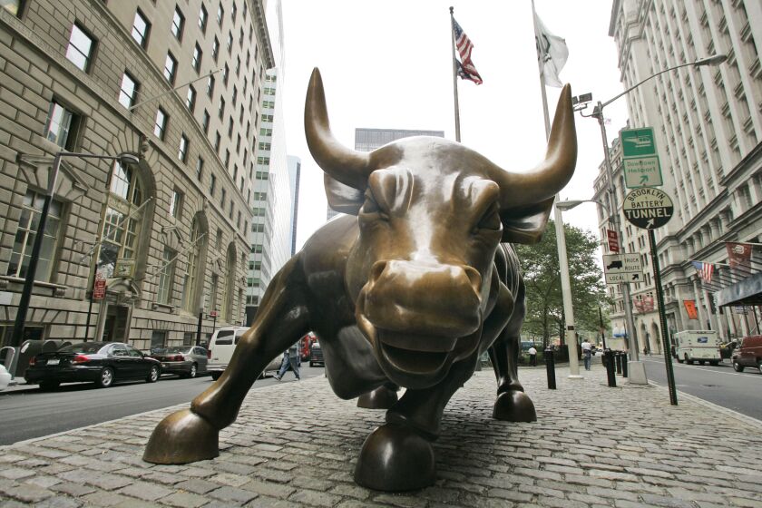 FILE- This Oct. 18, 2008 file photo shows the Charging Bull sculpture in New York City's Financial District. The S&P 500 is now in what Wall Street refers to as a bull market, meaning the index has risen 20% or more from its most recent low. (AP Photo/Mary Altaffer, File)
