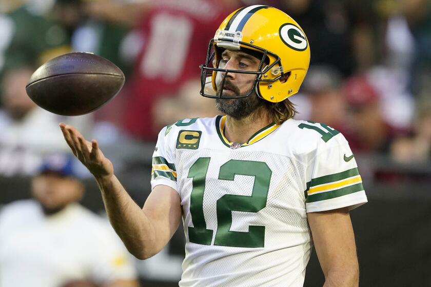 Green Bay Packers quarterback Aaron Rodgers (12) warms up prior to an NFL football game against the Arizona Cardinals, Thursday, Oct. 28, 2021, in Glendale, Ariz. (AP Photo/Darryl Webb)