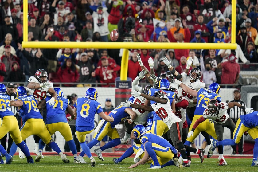 Los Angeles Rams' Matt Gay (8) kicks a 30-yard field goal to defeat the Tampa Bay Buccaneers during the second half of an NFL divisional round playoff football game Sunday, Jan. 23, 2022, in Tampa, Fla. (AP Photo/John Raoux)