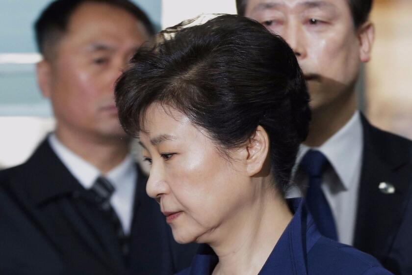 (FILES) This file photo taken on March 30, 2017 shows South Korea's ousted president Park Geun-Hye (front) arriving for questioning on her arrest warrant at the Seoul Central District Court in Seoul. Park, whose impeachment was confirmed by the country's top court last month, now faces charges including bribery, coercion, abuse of power and leaking state secrets, Seoul prosecutors probing the scandal said in a statement on April 17, 2017. / AFP PHOTO / POOL / Ahn Young-joonAHN YOUNG-JOON/AFP/Getty Images ** OUTS - ELSENT, FPG, CM - OUTS * NM, PH, VA if sourced by CT, LA or MoD **
