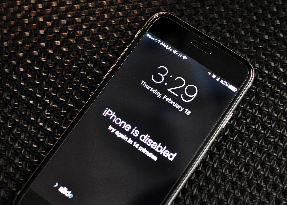 An iPhone displays a "disabled" message