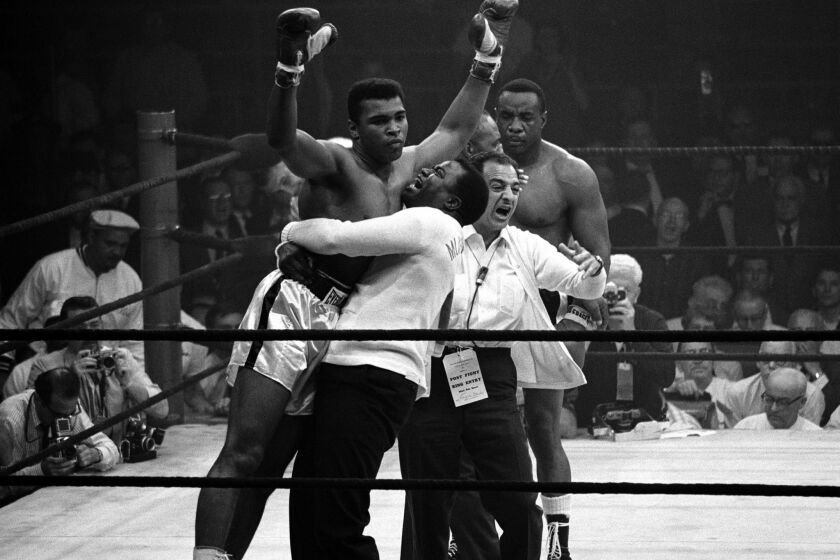 Heavyweight champion Muhammad Ali after his rematch with boxer Sonny Liston on May 25, 1965.