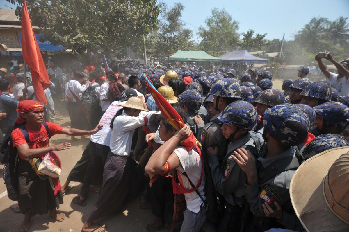 Student protesters clash with riot police during a march in Letpadan, Myanmar on March 10.