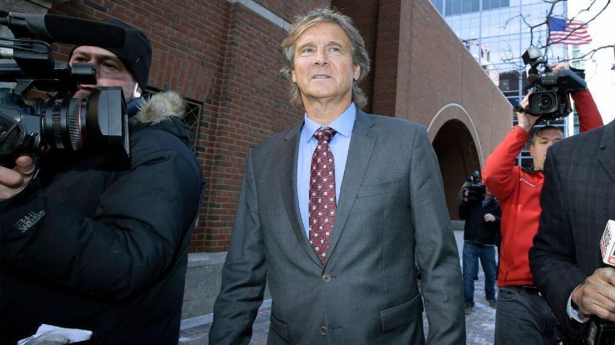 Jovan Vavic, former USC water polo coach, departs federal court in Boston on March 25.