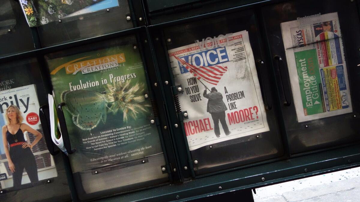 The Village Voice is on sale at a newsstand on 42nd Street in New York on Aug. 22. It has since gone out of business.