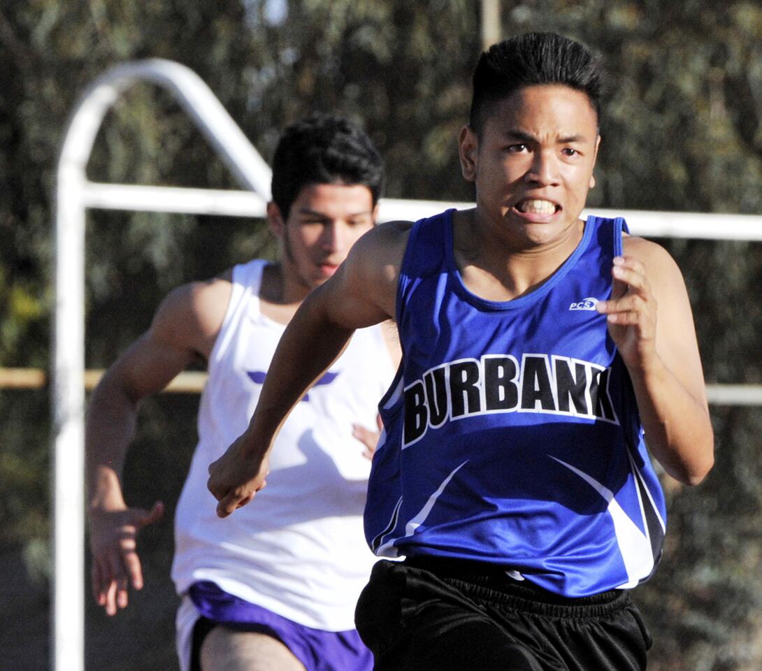 Burbank's Hideki Nakazawa competes in the 200 meter in a dual track meet between Crescenta Valley, Burbank, and Hoover at Crescenta Valley High School on Thursday, March 13, 2014.