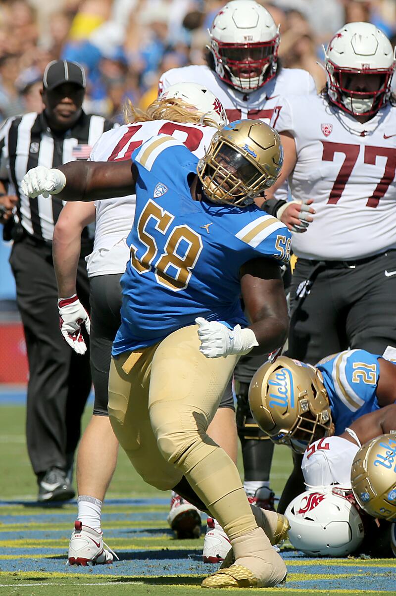 UCLA defensive lineman Gary Smith III celebrates after the Bruins stop Washington State on a fourth-and-one.