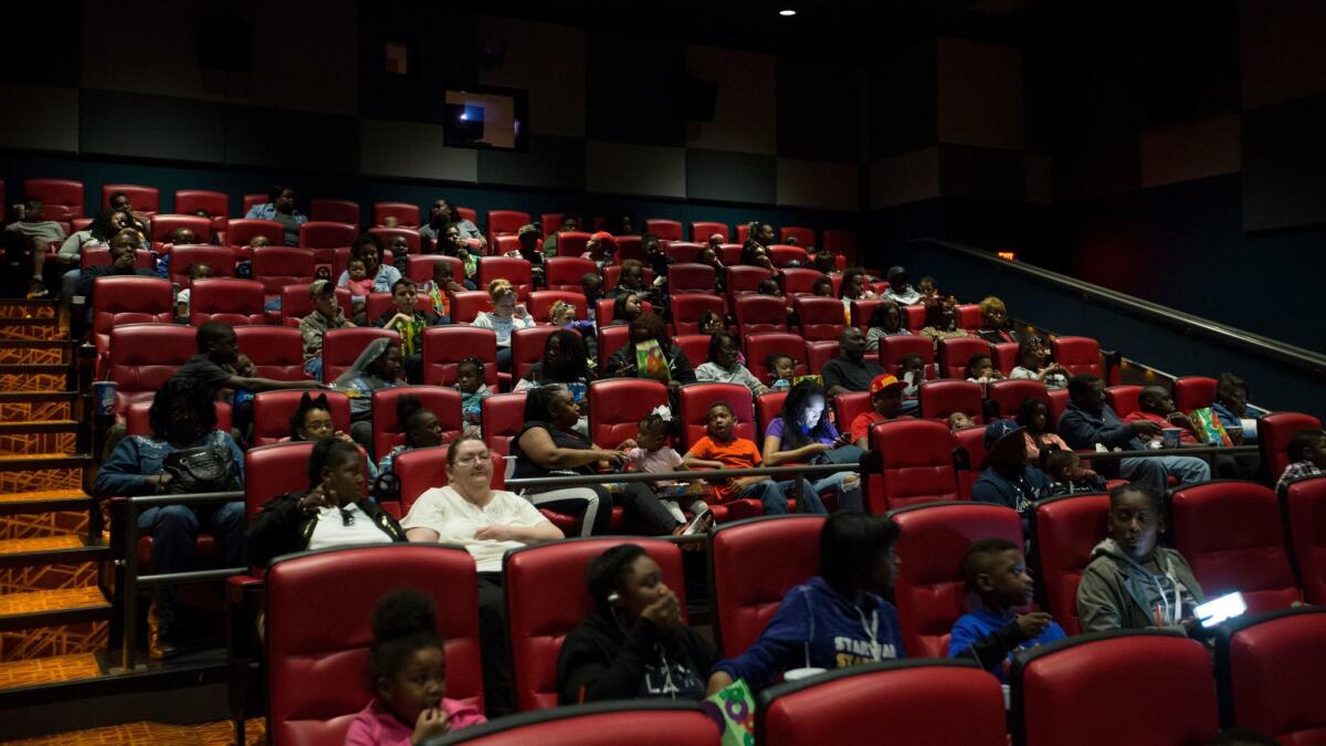 A theater at 24:1 Cinema fills up for a Sunday morning showing of "The Boss Baby" in northern St. Louis County.
