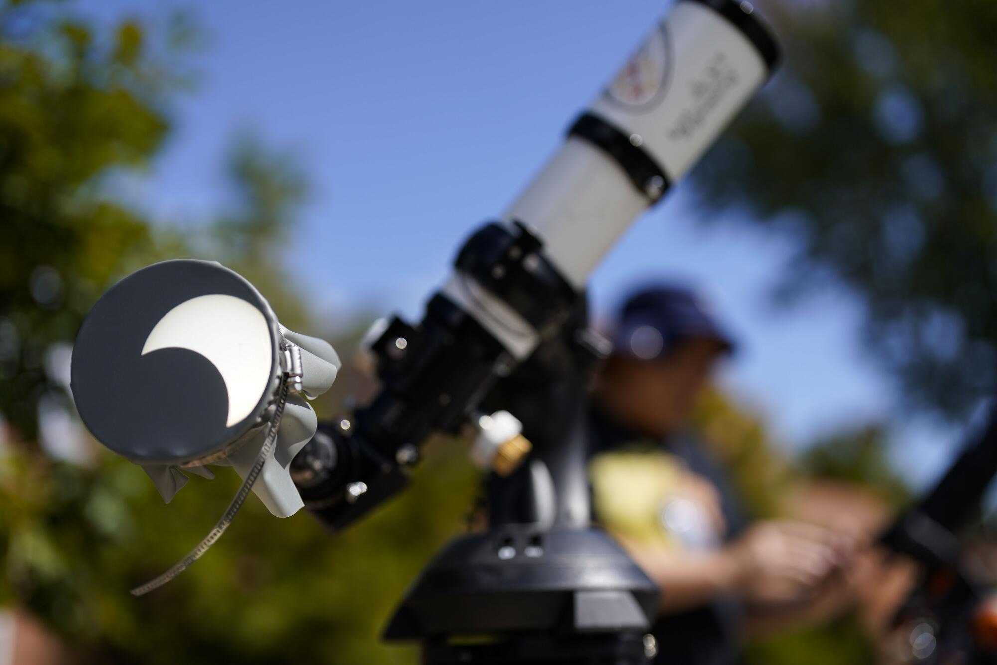 A partial solar eclipse is seen on a telescope.