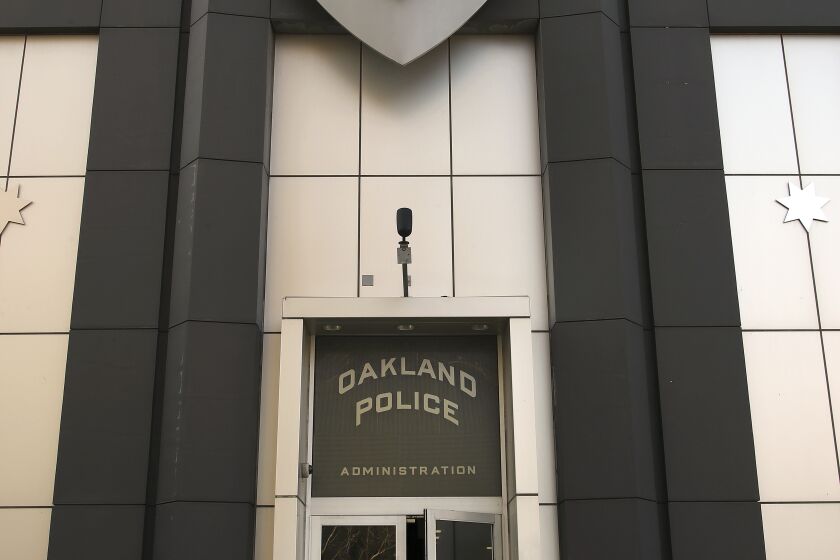 Women enter the Oakland Police building on Wednesday, Jan. 31, 2018, in Oakland, Calif. (AP Photo/Ben Margot)
