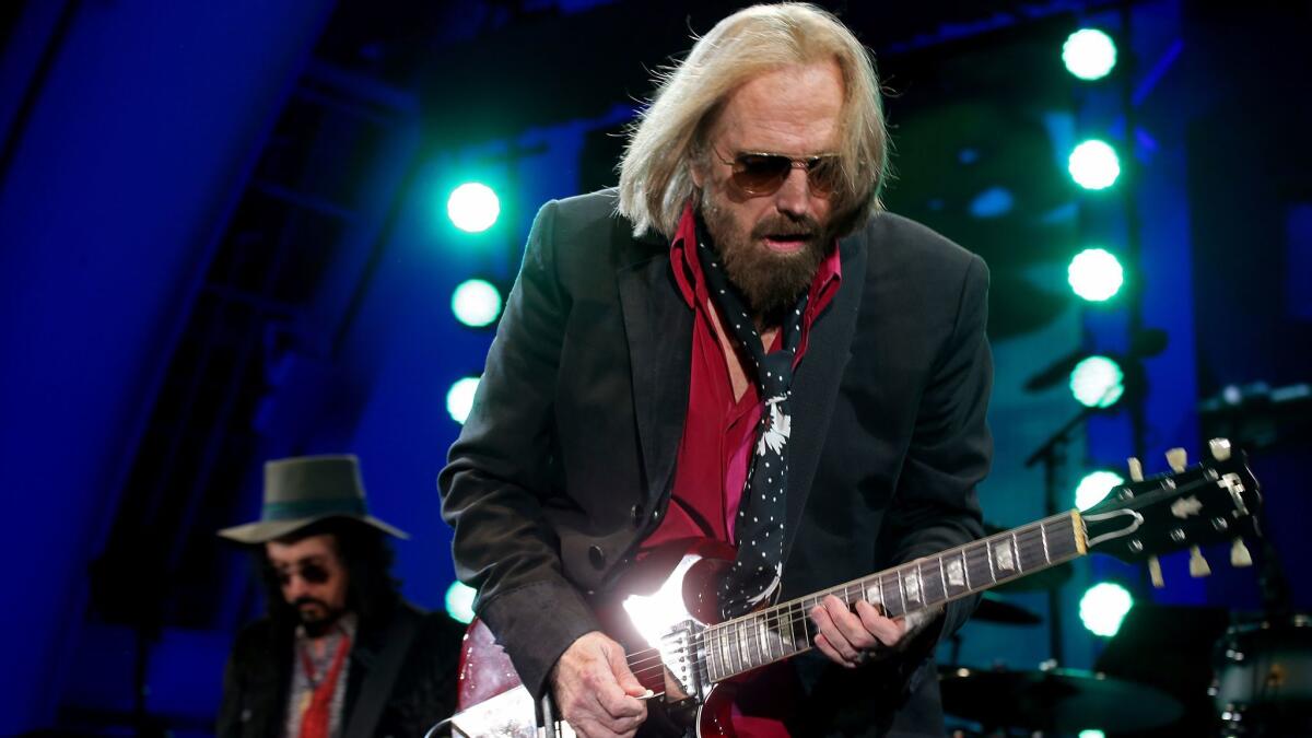 Tom Petty, shown performing on Sept. 21 with the Heartbreakers at the Hollywood Bowl, will be saluted Oct. 17 at a benefit for the MusiCares Foundation.