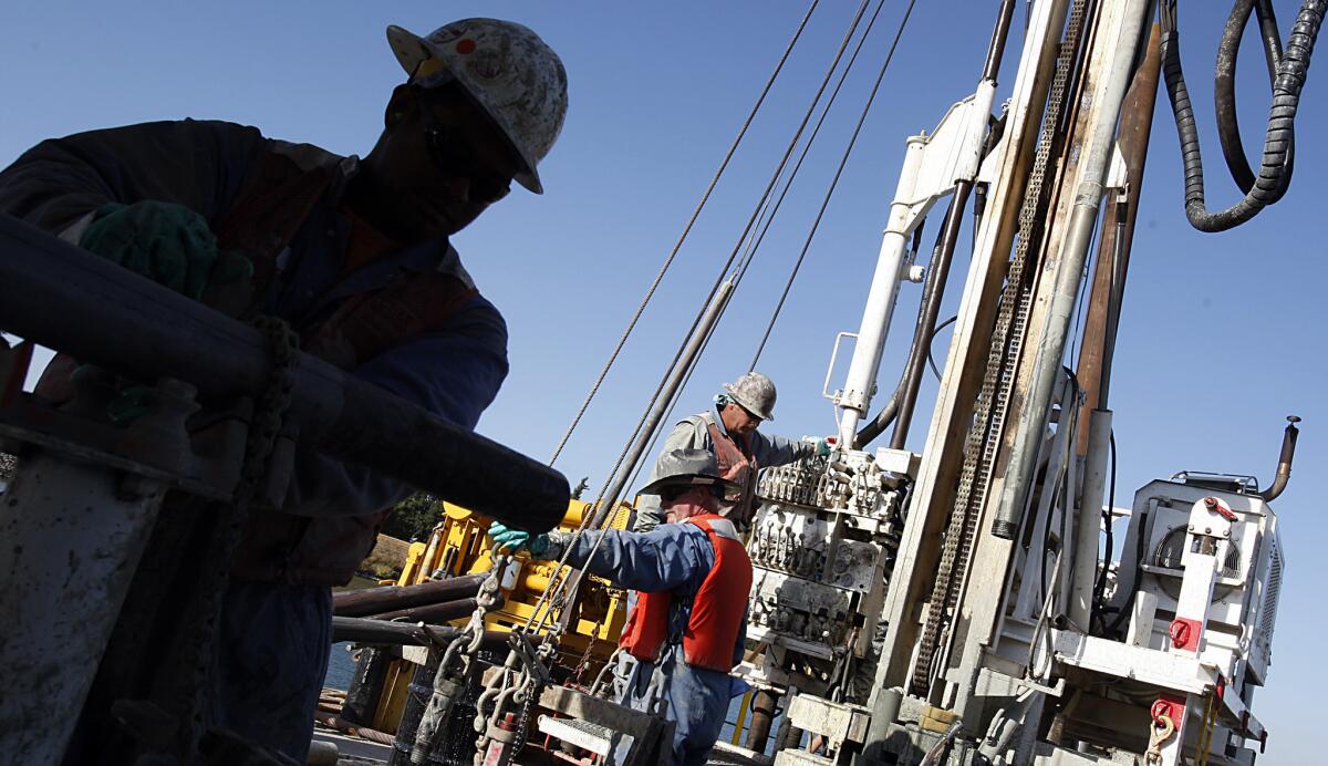 Workers drill for soil samples in the Sacramento-San Joaquin Delta, where the state is proposing to construct two large water tunnels.